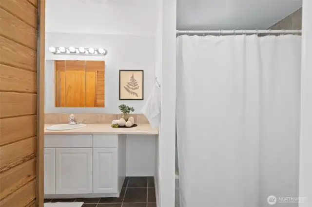 Full bathroom downstairs with sauna