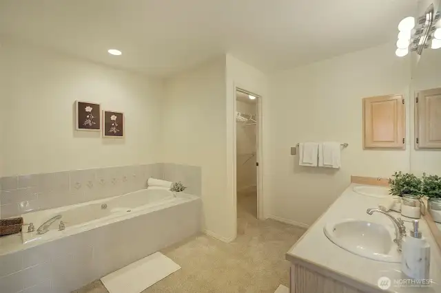 A double vanity and deep, jetted soaking tub compliment the Ensuite bathroom.