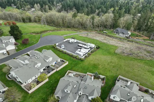 A fenced-in RV parking area is available for community use.