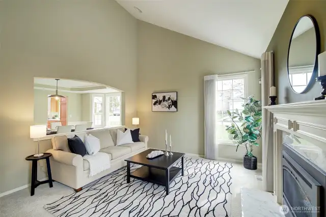 The vaulted ceilings and curved opening to the dining room offer style and architectural interest.