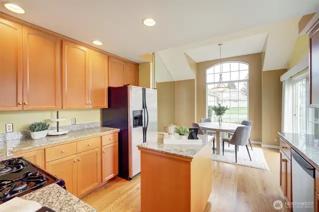 The spacious kitchen blends seamlessly into the breakfast nook.