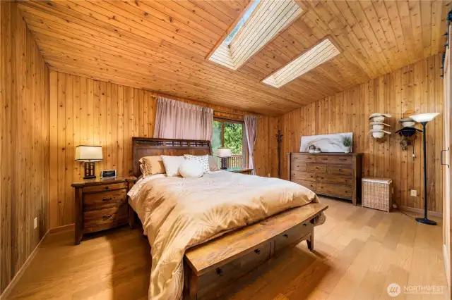 This primary suite has lots of natural light and feels warm and cozy.