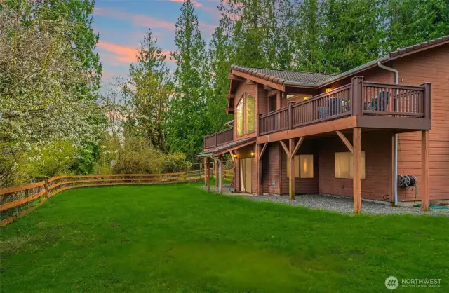 Fenced backyard that overlooks the rest of the property.