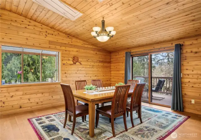 Skylights over the dining area bring in lots of natural light and keep the space feeling light and bright with the vaulted ceilings.