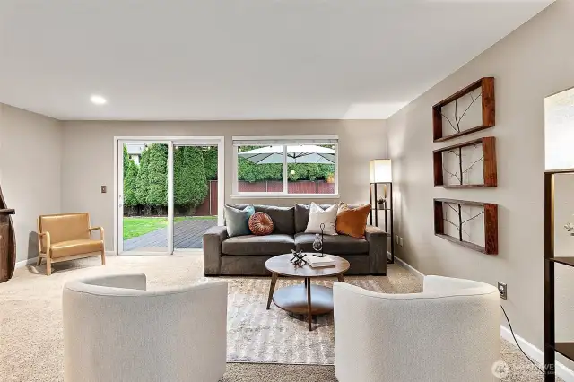Warm and inviting living room with seamless access to the backyard.
