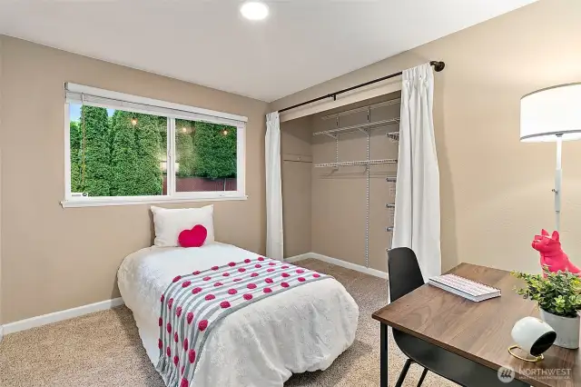 There is ample closet space in all of the bedrooms, including this cute first bedroom down the hallway.