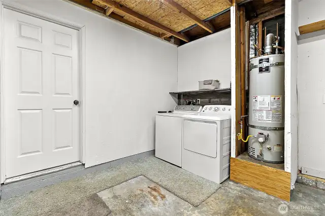Washer and dryer are conveniently located in the garage, just off the kitchen and dining.