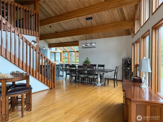 Large dining area & bright kitchen with glass breakfast nook with a view.