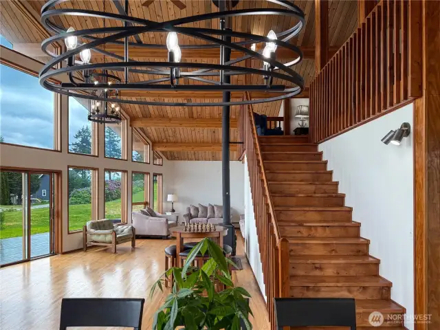 Soaring ceilings with gorgeous exposed beams & real hardwood floors, interior is freshly painted.