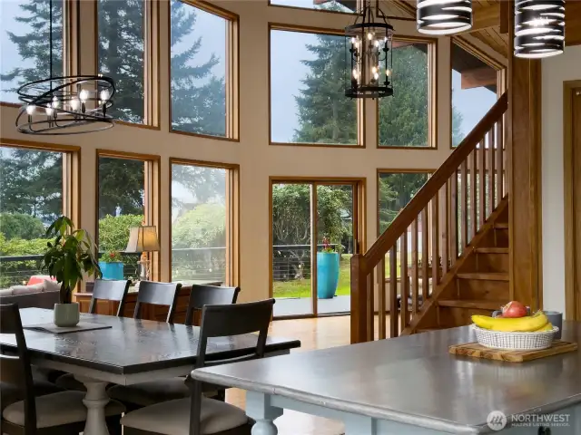 Kitchen looking into the open dining & living areas, slider lead out to the 720 sq ft deck.