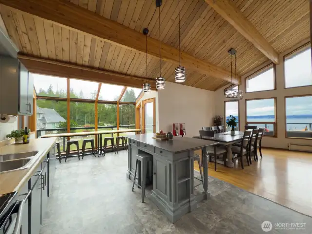 Kitchen with island, breakfast nook & open to the large dining area.