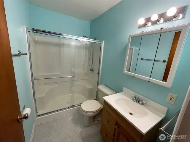 Bath with step in shower