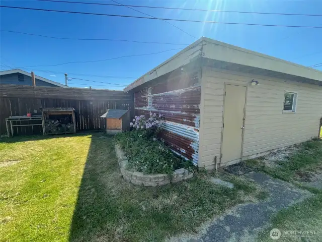 Metal on garage wall is just for aesthetics - wood siding behind.