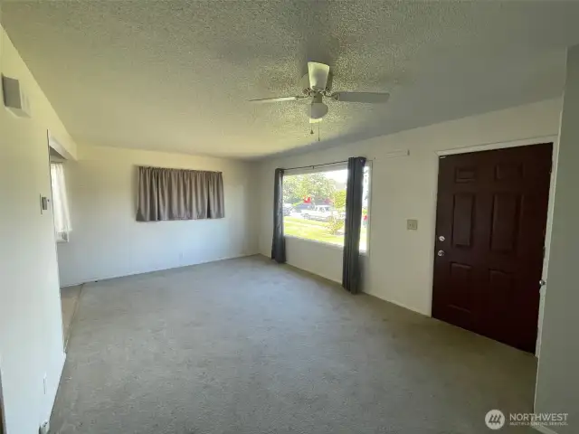 Living room with large east facing window
