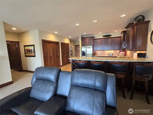 Living looking to the kitchen with eating bar.