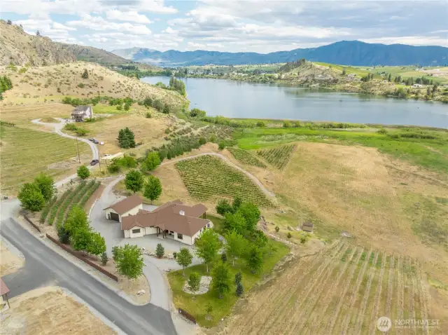 EXTERIOR FEATURES  • Private domestic water well and septic system  • 450-liter propane tank  • Paved driveway and partially chip-sealed access road  • Covered front and side porches, back patio with spa  • Secure dog area with home access  • Mature landscaping with rock walls