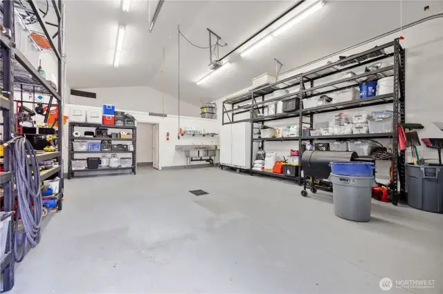 DETACHED GARAGE  • 22’ x 35’ building  • Fully finished with automatic garage door  • Half bathroom   • Industrial triple sink  • Indoor/outdoor dog kennel with easy-clean concrete baseboards and multiple drains  • Storage loft and ceiling hooks for hobbies  • Wired for electric heating
