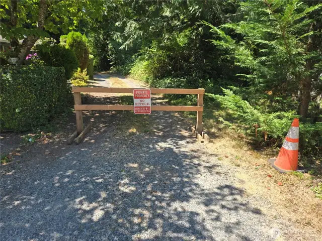 Property past this barrier - park on the city street and walk down the driveway past this wooden barrier