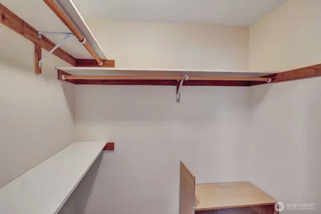 Walk-in closet in primary bedroom.