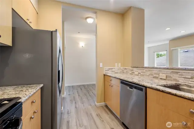 Stainless steel appliances complement this kitchen.