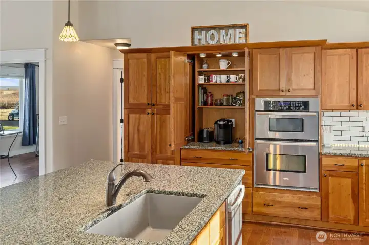 Cabinet opens up to reveal your own personal coffee bar.