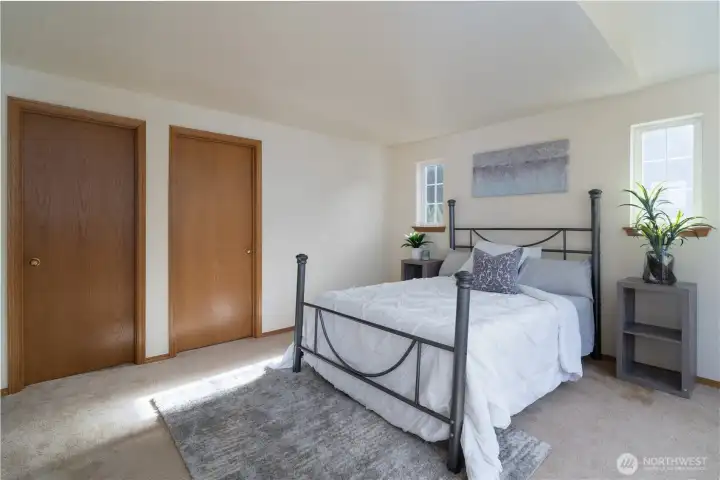 Primary bedroom (doors to walk-in closet & full bath)