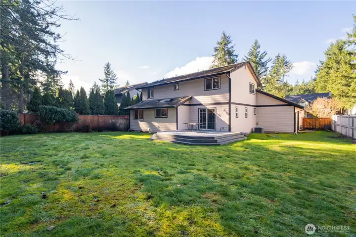 Large fully fenced back-yard with composite deck & low maintenance landscaping