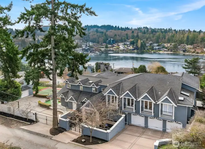 Experience a truly extraordinary, fully gated custom estate set on a rare 20,237-square-foot lot with sweeping views of the Salmon Bay Waterway, Puget Sound, and the Olympic Mountains. This is Pacific Northwest living at its finest.