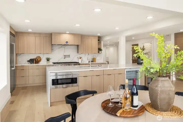 The sunlit breakfast nook off the kitchen offers an inviting setting for relaxed morning meals.