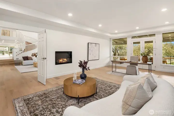 Designed with intention, the library includes a fireplace with wiring for accent lighting or porcelain display, a floor outlet perfectly placed for a centered desk, and a whole-home music system powered by a central amplifier.