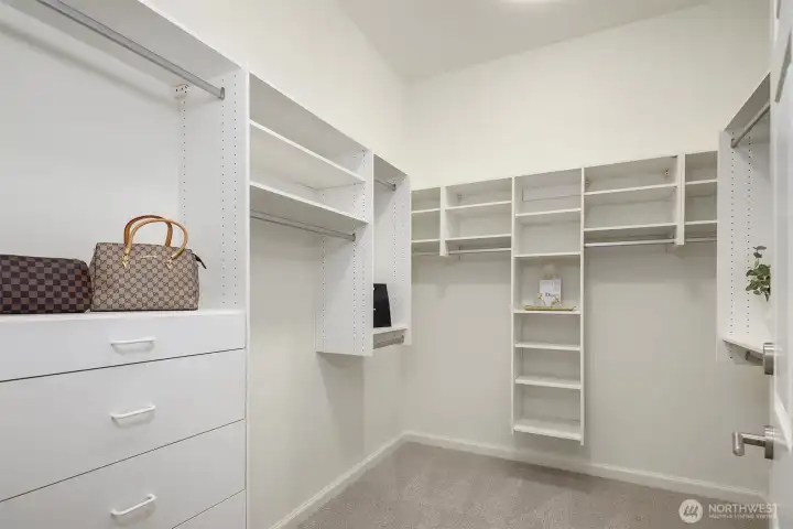 Spacious, walk-in primary closet.