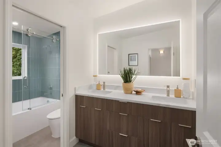 One of three well-appointed full baths upstairs serving the secondary bedrooms.