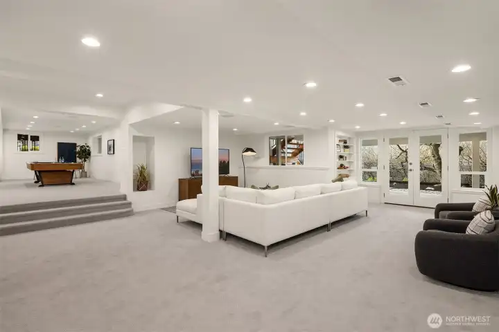 The lower level is a versatile haven, ideal for a teen retreat, ultimate game room, or multigenerational living.