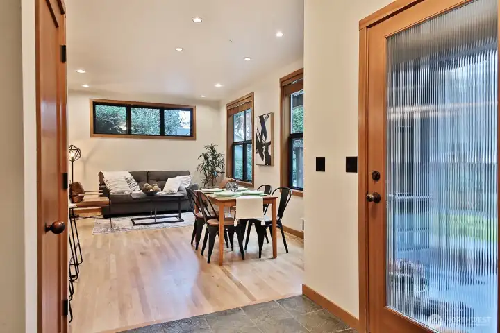 Slate entry leads to beautiful hardwood floors.