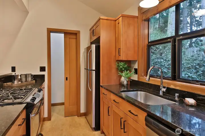 Enjoy cooking on the gas cook top and there is plenty of storage in the walk-in pantry.