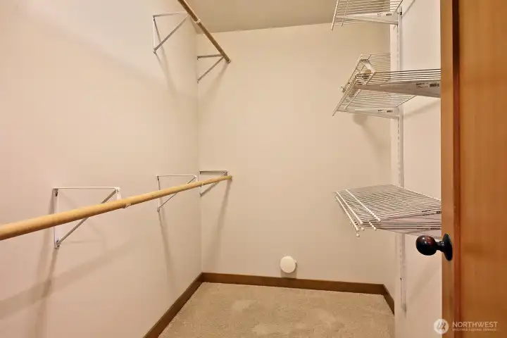 Spacious primary suite walk-in closet.