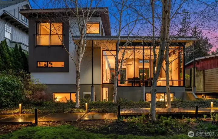 Mature birch trees frame a Japanese garden-style approach, leading to a formal entry that instantly shifts the mood from city to sanctuary. From the home, daily life feels effortlessly curated—quiet and private at home, yet moments from Seattle’s best. Montlake favorites like Oxbow and Café Lago are just a quick hop away, and the 19th Ave corridor—home to Monsoon and Rocket Taco—is equally close for an easy weeknight dinner. In the same short radius, you’ll find neighborhood staples along 15th Ave E, including Rione XIII and Smith, while the waterfront village of Madison Park—with beloved spots like How to Cook a Wolf, Cactus, and The Attic—is an easy drive when you want dinner that feels like a mini escape.