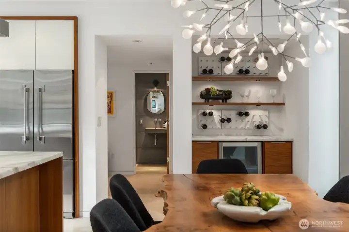 The home’s material palette is quietly confident, and it shows up in the details—like a sculptural calm created by concrete elements, including a cast concrete sink in the powder room (pictured here), concrete walls and floors on the lower level, and the home’s statement fireplace that anchors the living experience with modern serenity.