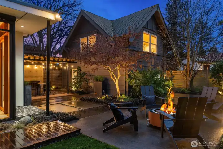 Carriage house reimagined: Originally built in 1917, the former carriage house now  serves as a detached one-car garage with ~480 sq ft of finished living space  above—complete with kitchen, loft-style sleeping quarters, laundry, and bath.