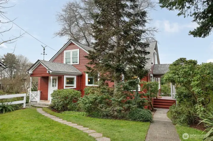The path to the right goes from the alley parking to the main front door entrance, and the left path takes you to the mudroom (and a couple steps down to the DADU entrance).
