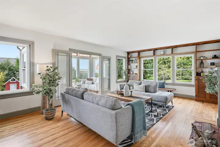 The living room and sunroom are the focal point of the home, with incredible views of the Puget Sound and Olympics.