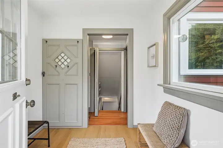 Mudroom connects to kitchen (to right of door) and stairs down to spacious basement with tons of great storage, workshop, laundry and game room.