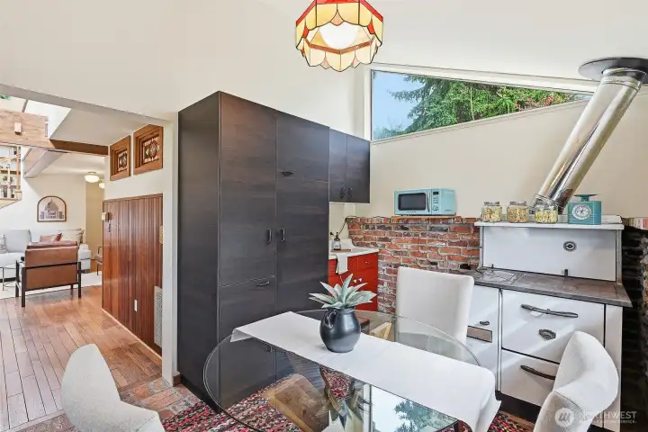 Office / pantry / dining room with cool vintage wood stove (just cleaned and serviced in 2026) adds even more functionality to this great DADU!