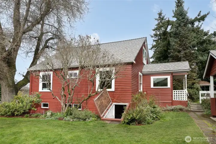Awesome basement cellar door adds to the farmhouse charm of this home.