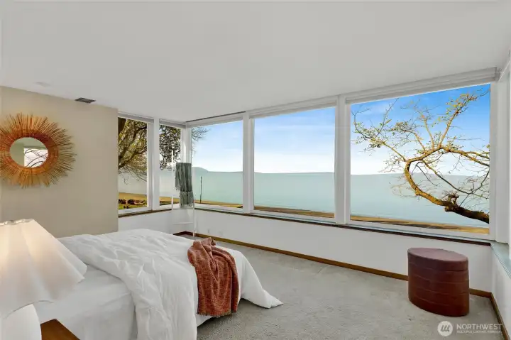 The second floor primary suite...one of two in the home...has amazing views