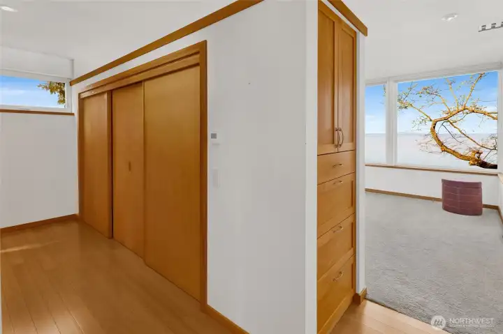 The second level primary suite has lots of closet -space and built-in cabinets