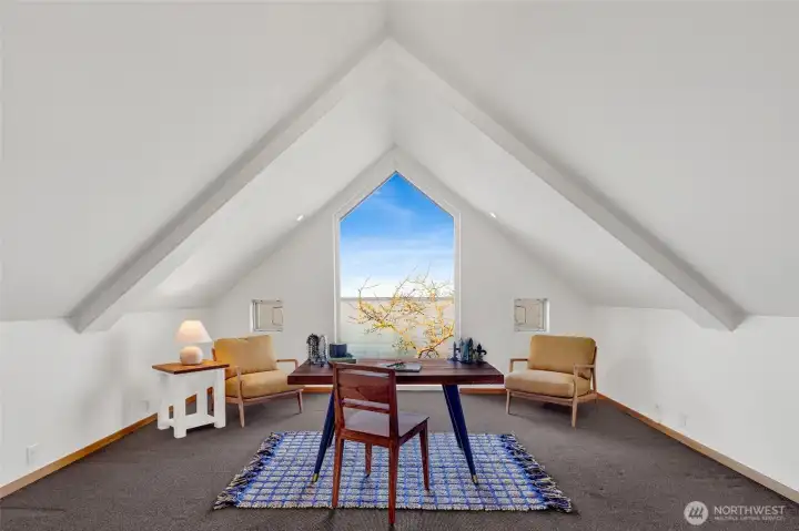 The third level features an amazing room with stunning views. Great for a third bedroom, home office, artist studio, den...bring your vision