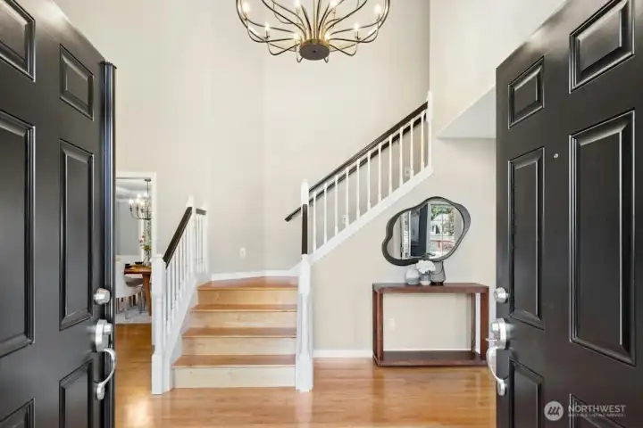 Solid maple hardwoods, new updated lighting, and vaulted ceilings greet you at the main entry