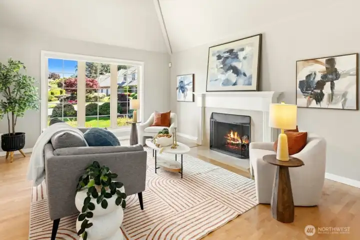 Vaulted ceilings and a gas fireplace Along with picture windows to the front yard, make the living room a great entertaining space!