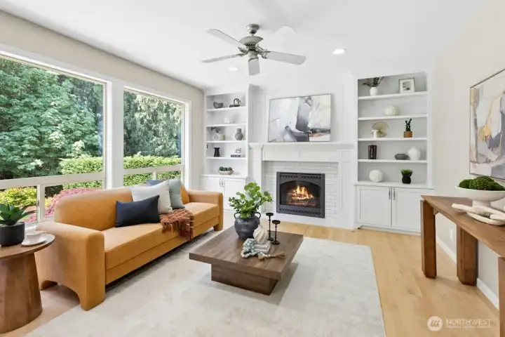 Fully updated family room with gas fireplace, built-in shelving, And remote control blinds on the exterior!